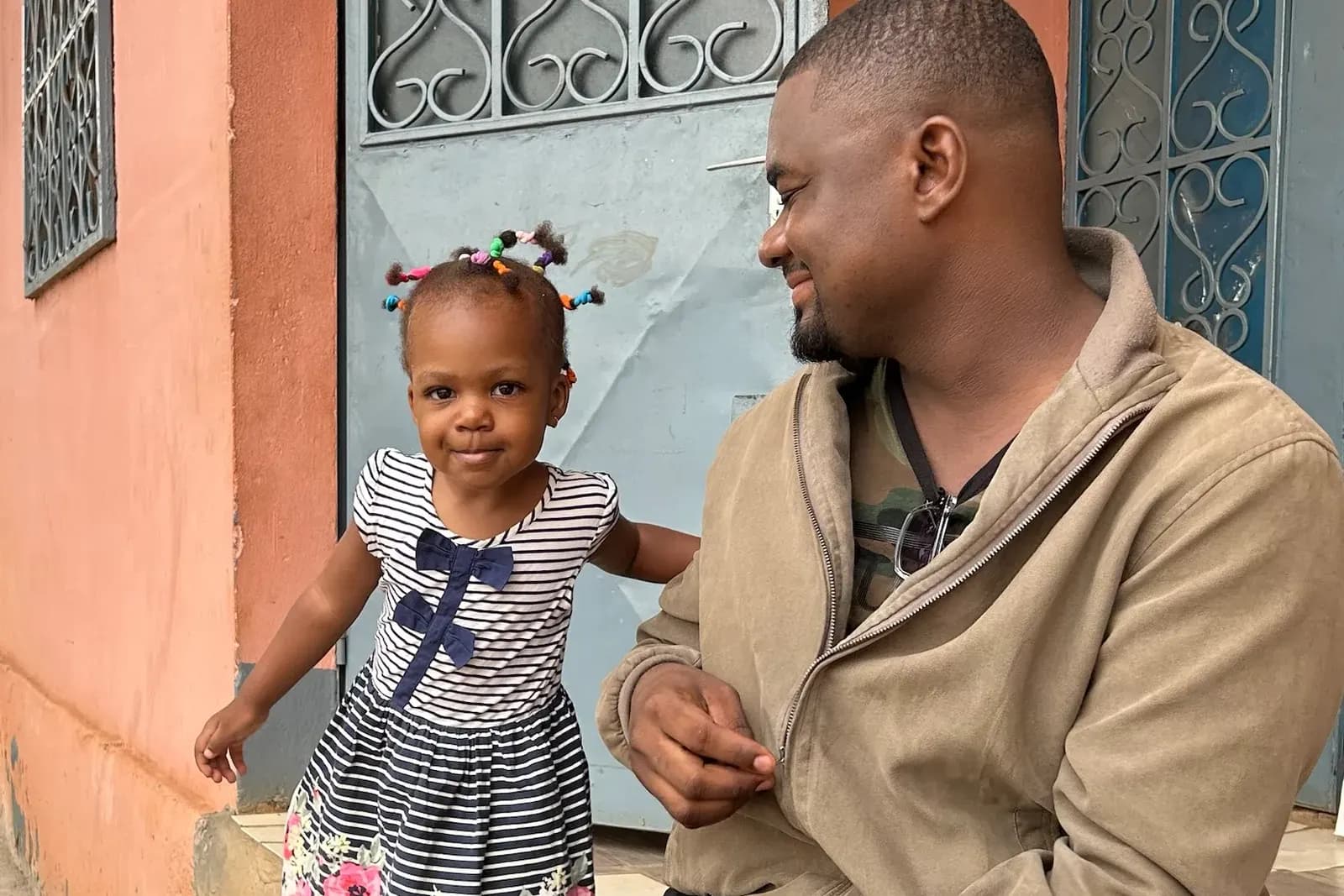 A J3 Khai ambassador with his daughter in Cameroon